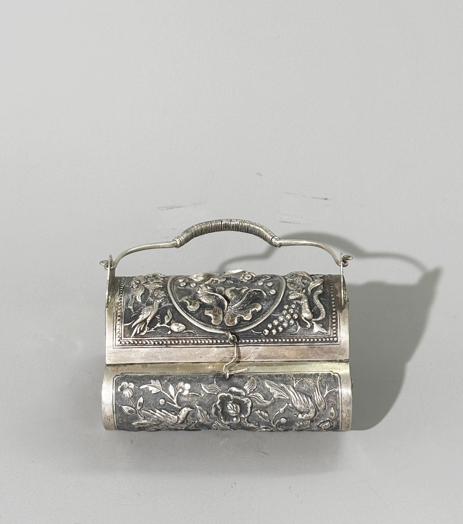 Rare Chinese Silver Repousse Incised Mini Handbag: Rare Chinese Silver Repousse Incised Miniature Handbag; the hinged cover with a center medallion of 2 Gold Fish with Squirrels and Grapes or Birds and Blossoms to the 4 corners, the front & back sides