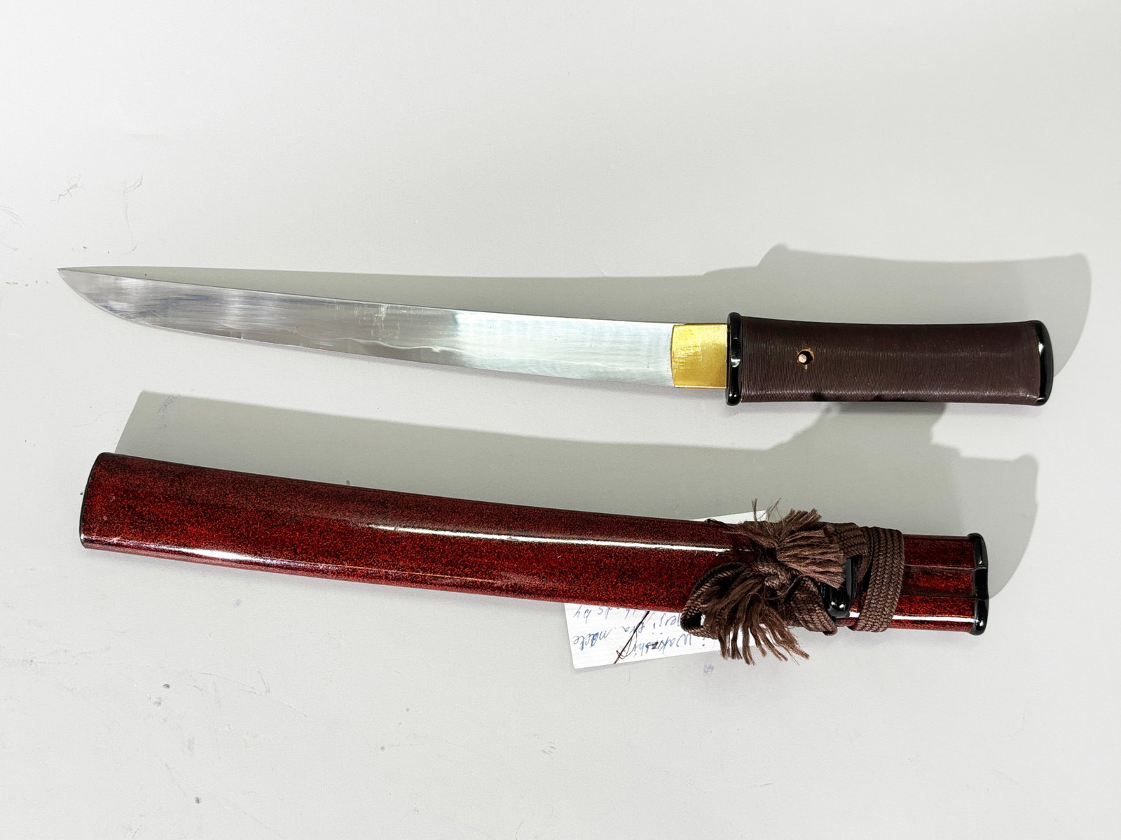 Japanese Samurai Tanto Blade, Storage Sheath: Japanese Samurai Tanto Blade in red & black flecked lacquered wood sheath with lacquered storage grip in textured brown lacquer. Total length 19 1/2 inches. Blade length 11 1/4''