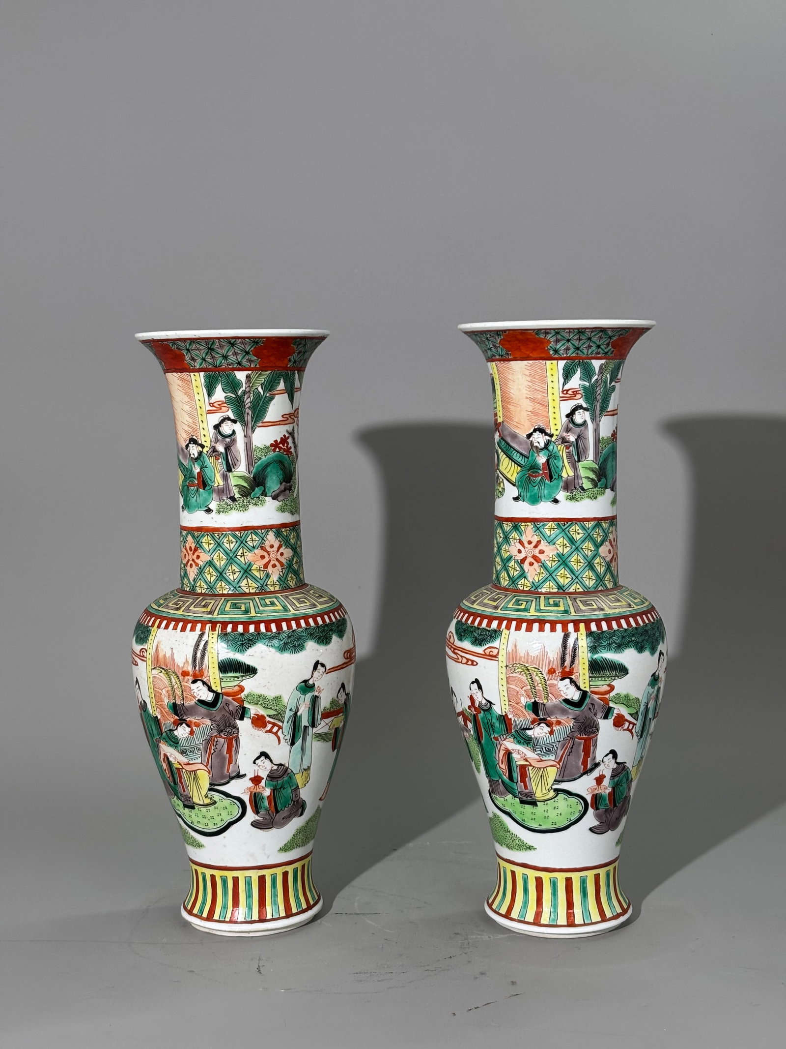 Pr Chinese Late Qing Famille Verte Porcelain Vases: Pr Chinese Late Qing Famille Verte enameled Porcelain Vases with a scene to the body of Court Figures preparing for a Theatrical Entertainment on a Garden Terrace, the flared necks with further Figure