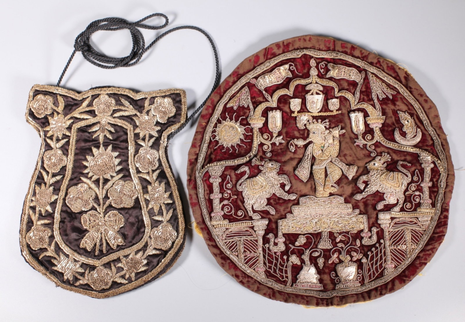 Antique India Silver & Gilt Embroidery: Antique India Silver, gilt, and tinted Silver Wire and Silver Paillette Embroidery: a round velvet with animals and a dancer surrounded by floral designs; together with a Shield-Shaped bag in black si