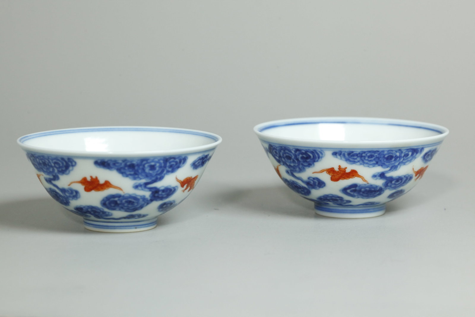 Fine Pr Chinese Qing Porcelain Bats & Clouds Cups: Fine Pair Chinese late Qing Dynasty Porcelain Bats & Clouds Cups with 5 iron red bats in underglaze blue clouds around the outside and a single bat to inside bottom, the recessed bases with 4 characte