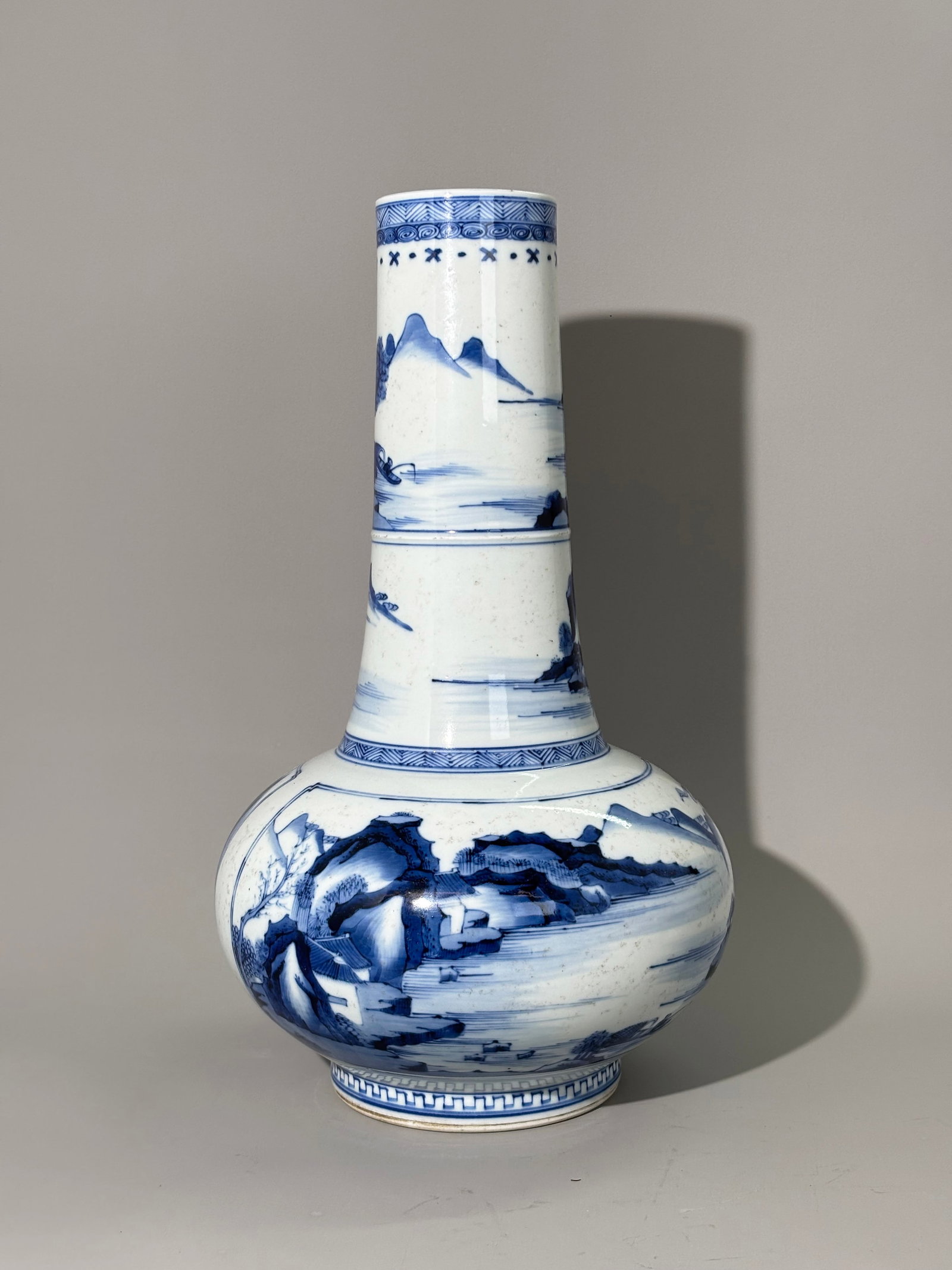 Chinese Blue & White Landscape Porcelain Vase: Chinese Blue & White Landscape Porcelain Vase, with tall cylindrical neck and globular body, underglaze blue painted. The neck is decorated with continuous river mountain landscapes. The rounded body 