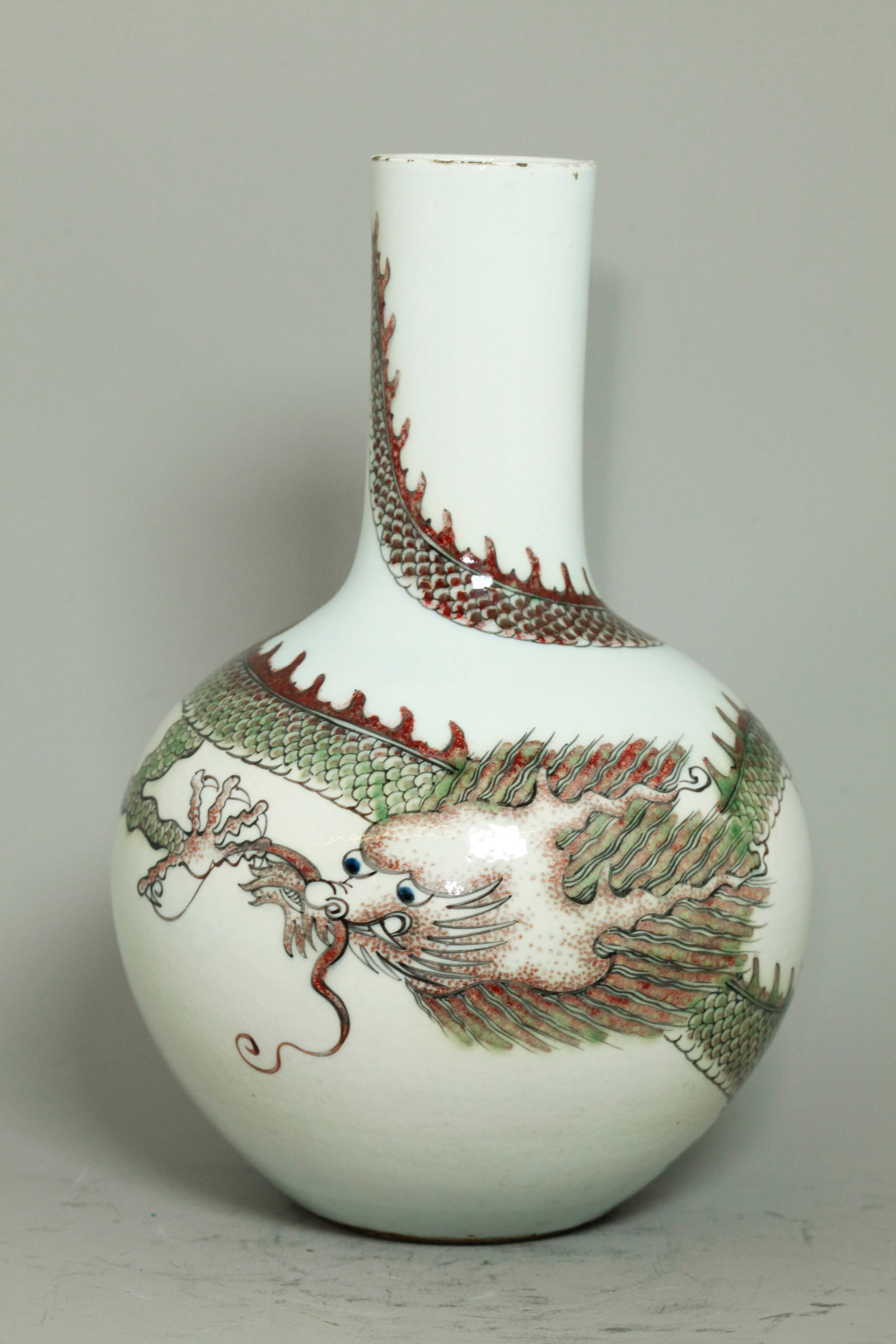 Chinese Underglaze Red 5-Claw Dragon Vase: Chinese Underglaze Red 5-Claw Dragon tianqiuping Vase with the Dragon wrapped around the body and neck in underglaze gray-black outline with underglaze blue eyes and underglaze red to scales and body 
