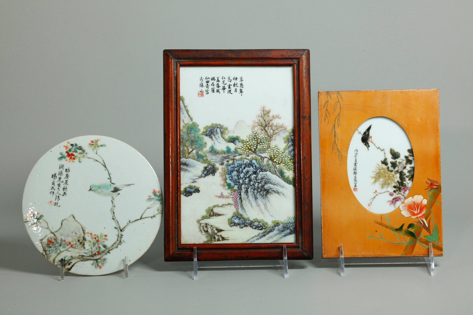 3 Sm Chinese Artist Enameled Porcelain Plaques: 3 Small Chinese Artist Enameled Porcelain Plaques, the largest a rectangle with a scene of 2 Scholars in a Boat in a Garden Pond with calligraphy & 1 red seal and framed in wood; a round plaque painte