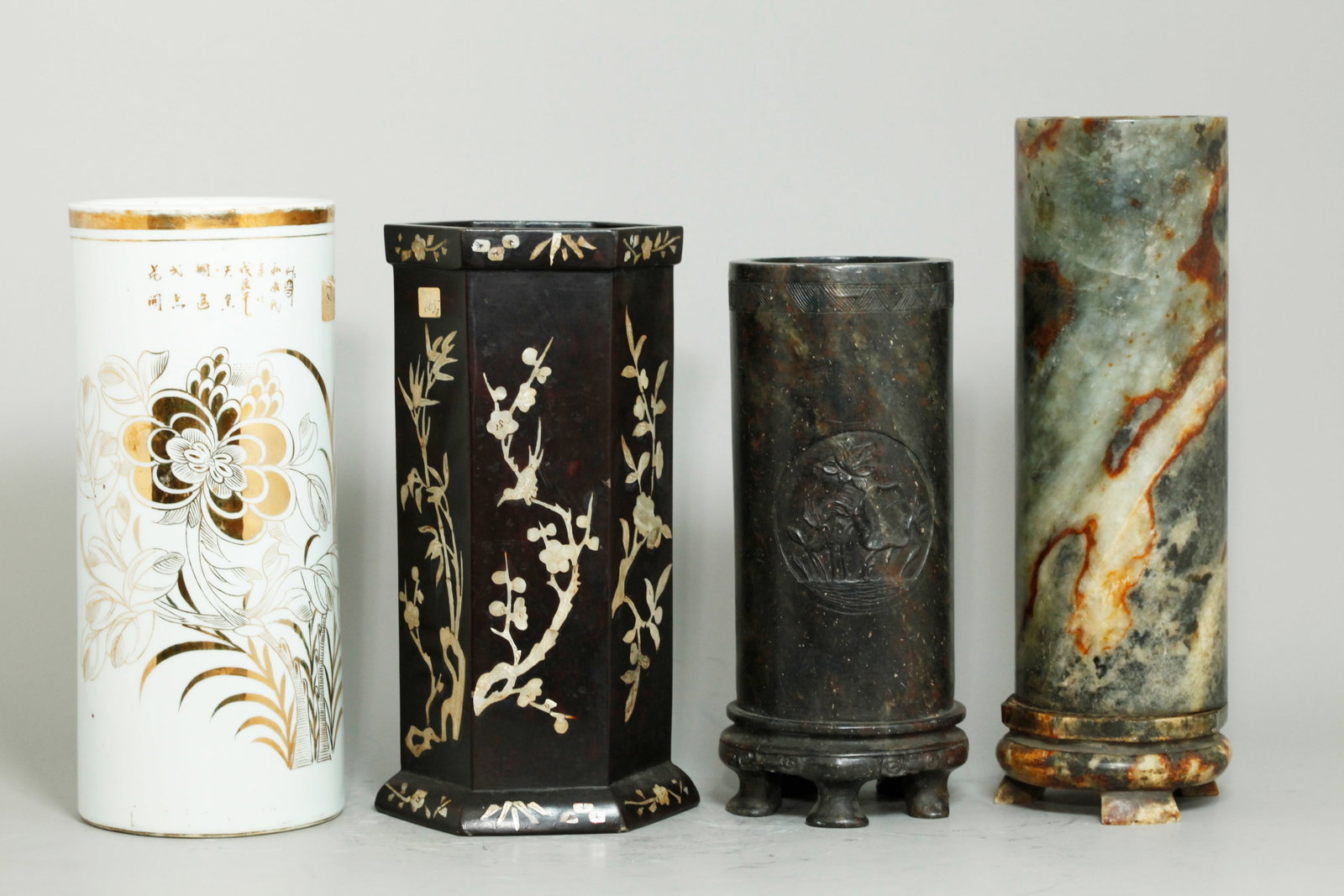 4 Chinese Hat Stands Vases Stone Wood Porcelain: 4 Chinese Hat Stands or Vases: 1 in dark shoushan soapstone with round carving front and back with Lotus Ponds and with 5 small feet to base, 1 gray to russet translucent hard stone mounted to matchin