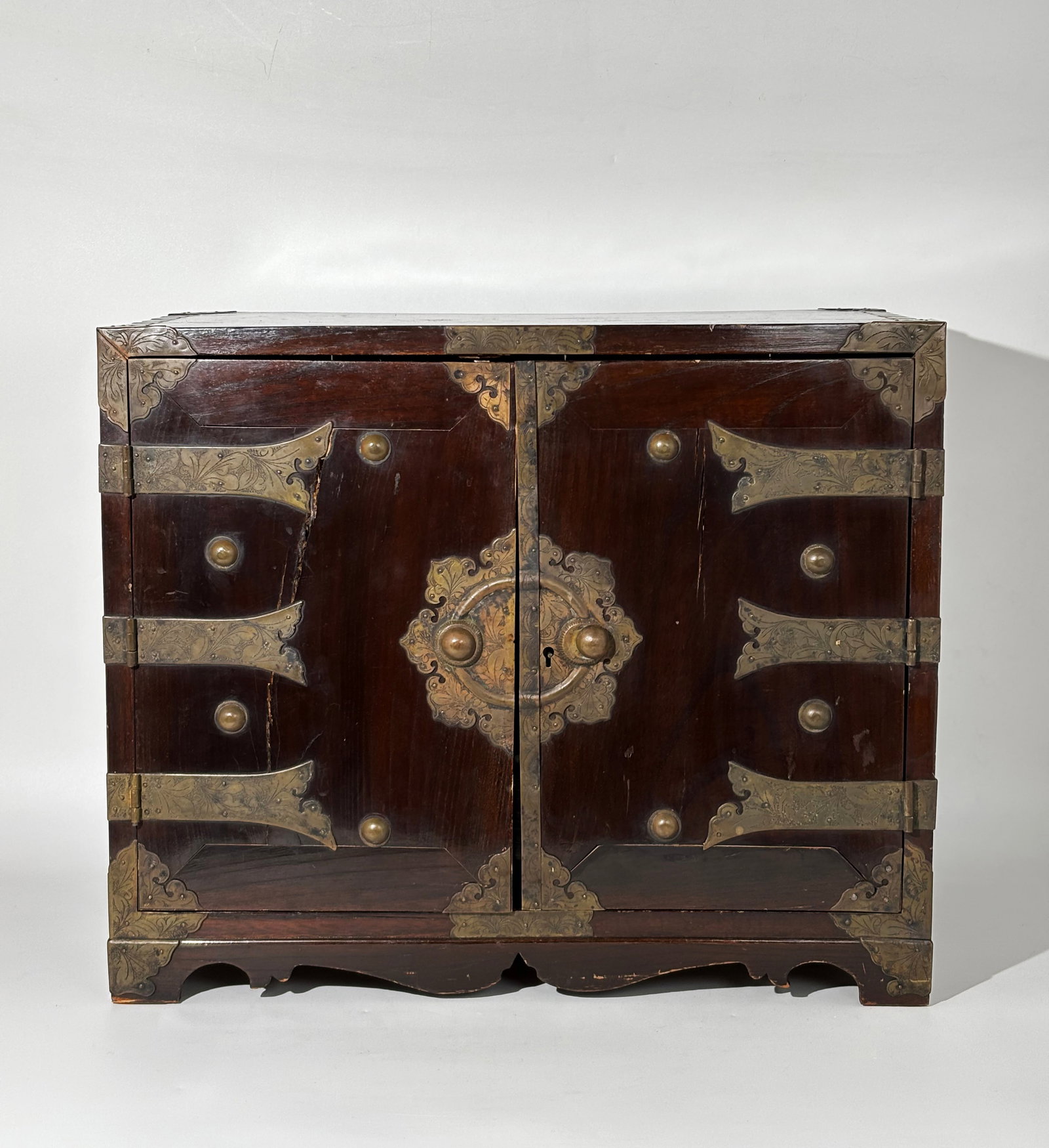 Fine Japanese 19th C Wood Metal Table Cabinet: Fine Japanese 19th Century Wood Table Cabinet, the engraved bronze corners and hinges on the 2 panel doors with lock plate and no key, one door with catch inside, and both opening to reveal 6 drawers