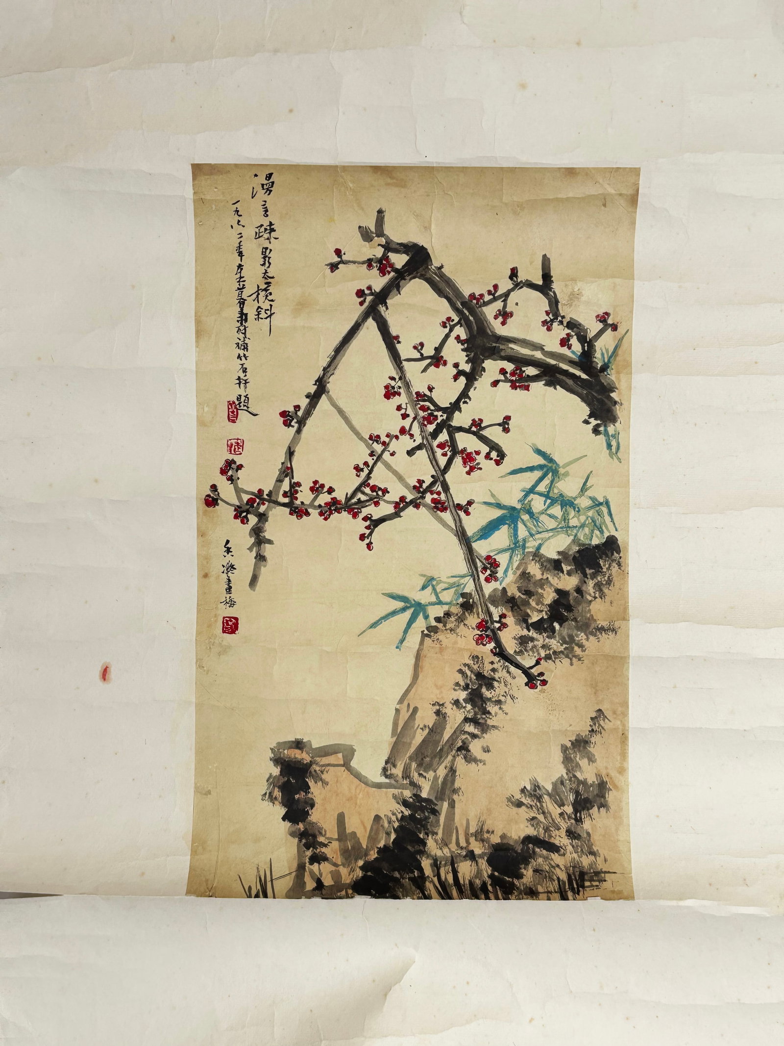 Attributed to Pan Tianshou; Plum Blossom & Bamboo: Attributed to Pan Tianshou; Plum Blossom & Bamboo and rock, Ink and paper, Chinese floral landscape painting depicting gnarled plum branches dotted with crimson blossoms, paired with turquoise bamboo 