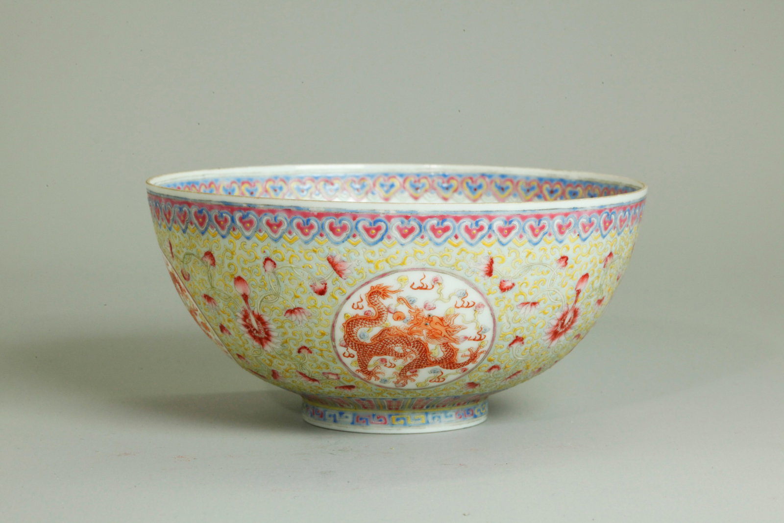 Chinese Egg Shell Porcelain Dragon Bowl: Chinese Egg Shell Porcelain Dragon Bowl; the inside with a Phoenix Bird roundel to center and Ruyi head border, the outside with 4 Dragon Roundels between pink flowers, yellow curls and a pale turquoi