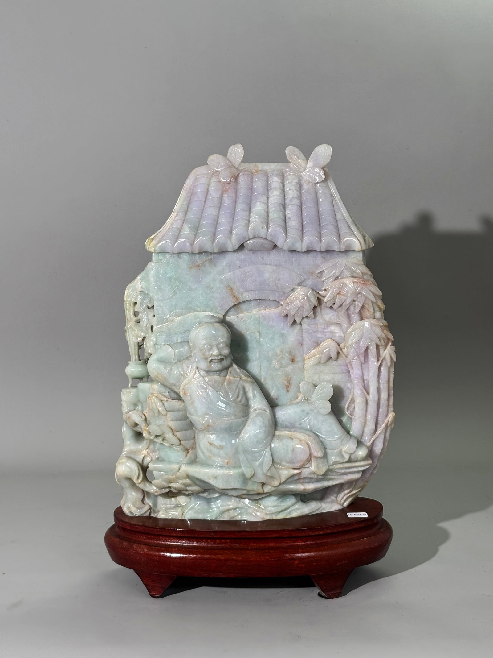 Large Chinese Pale Jadeite Carving; Gate & Scholar: Large Chinese Pale Jadeite Artist Carving in pale apple green to pale lavender with small spots of russet; well carved and polished with a sleeping Older Scholar resting on rocks with a censer burning