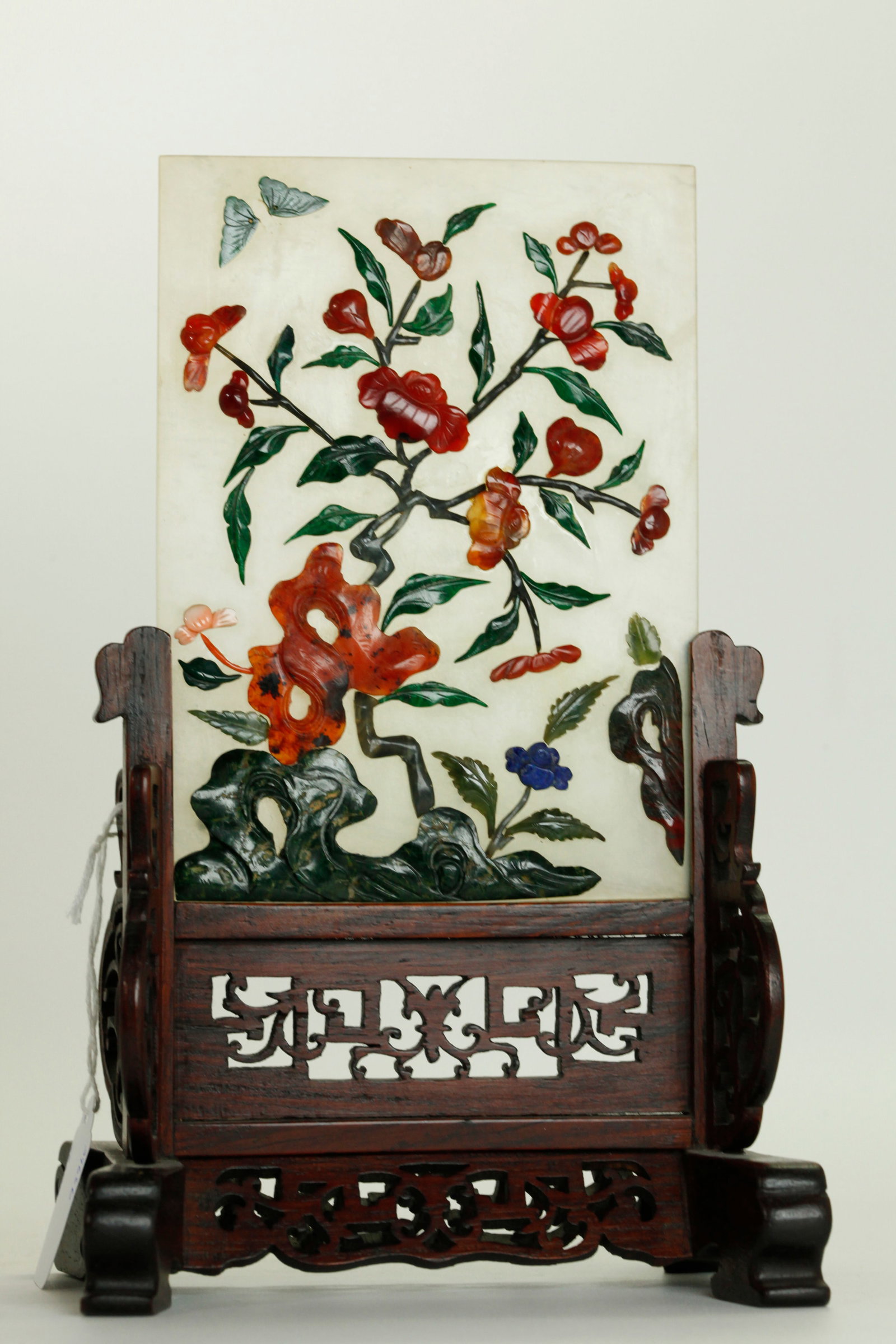 Chinese Qing Hard Stone Panel & Wood Table Screen: Fine Chinese Qing Dynasty Hard Stone Panel set with agate, lapis lazuli, coral, carnelian, malachite, etc carved as small flowers, leaves, a garden rock and a butterfly on a translucent pale celadon h