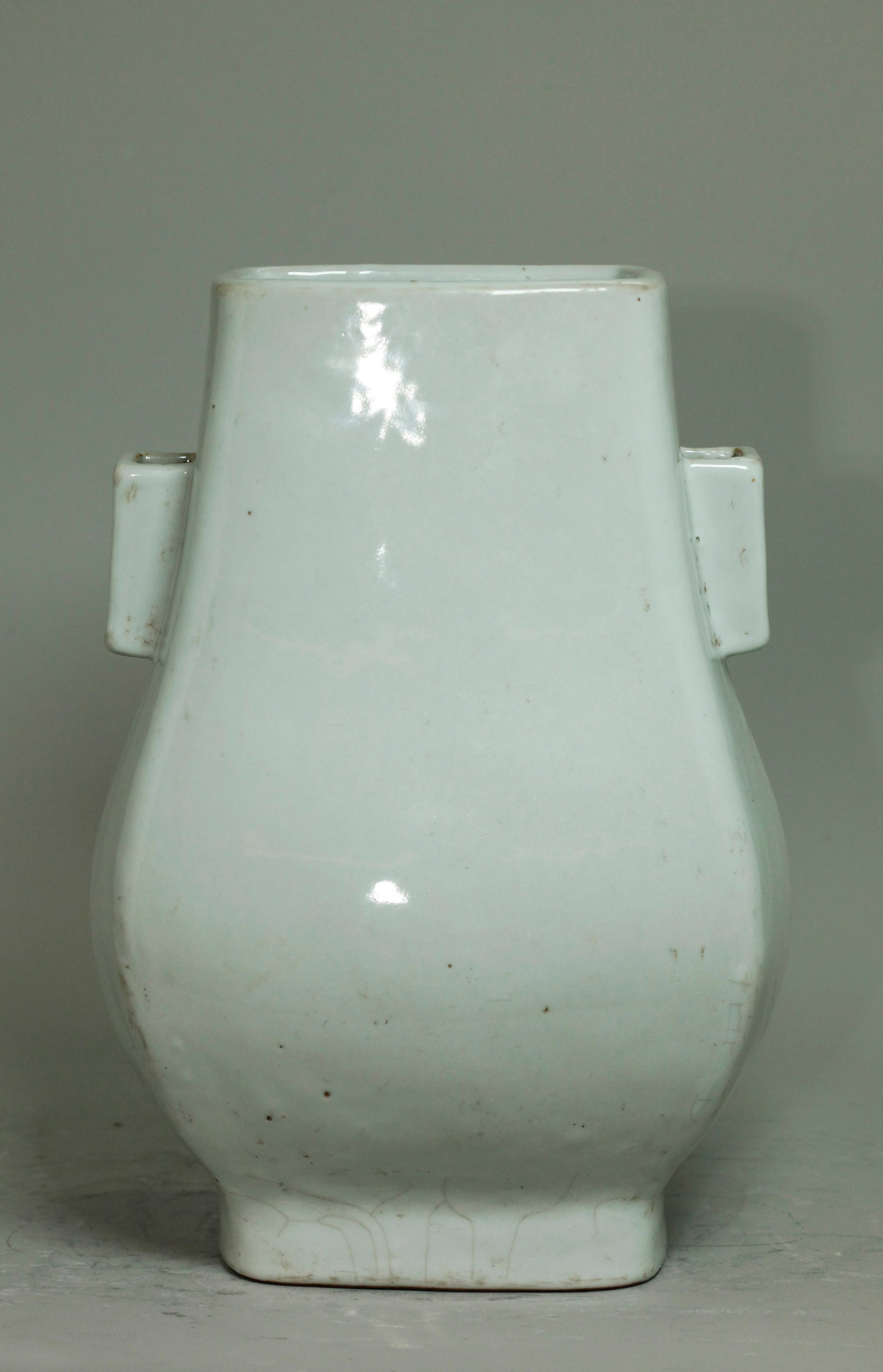 Lg Chinese Bluish-Clear Glaz Porcelain Hu Vase: Large and heavily potted Chinese Pale Bluish-Clear glazed Porcelain Hu Vase with 4 sides and cornered tube handles to neck, the glaze finishing evenly at the rectangular unglazed foot ring with some c