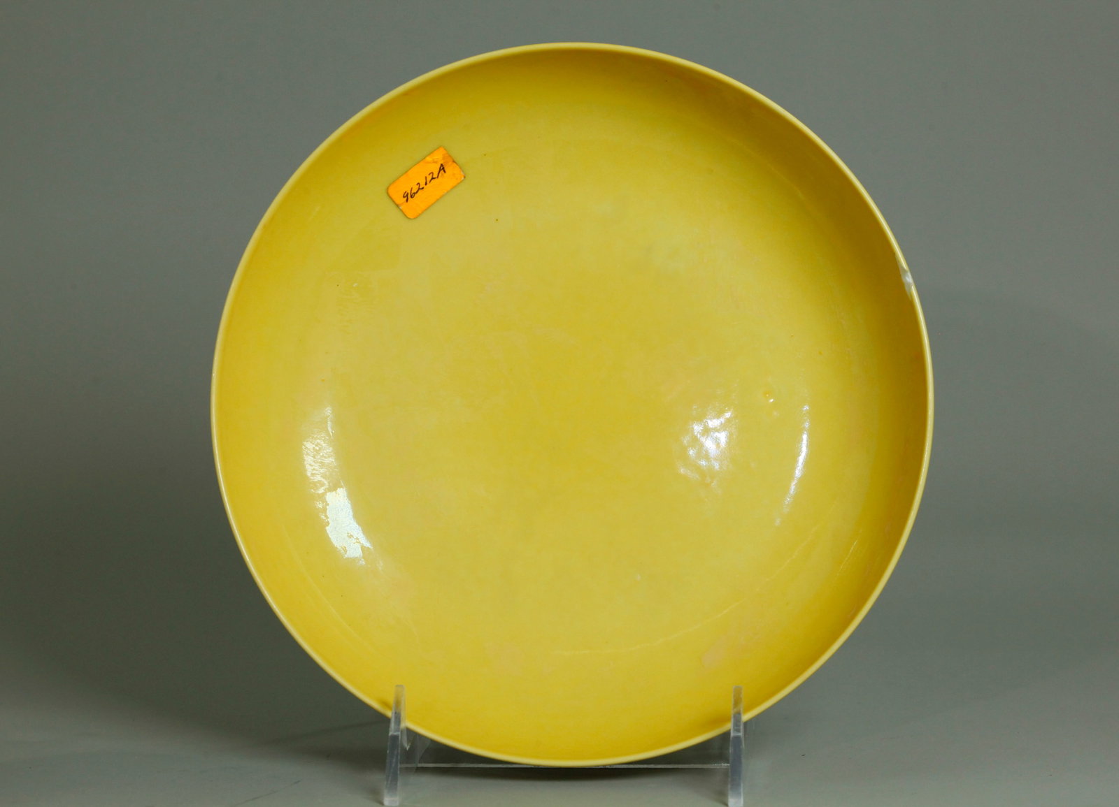 Chinese Bright Yellow Glazed Porcelain Plate: Chinese Bright Yellow Glazed Porcelain Plate, the recessed base in clear glaze with 6 character Chenghua mark inside double rings in a pale underglaze blue. Height 2 inches X diameter 8 inches