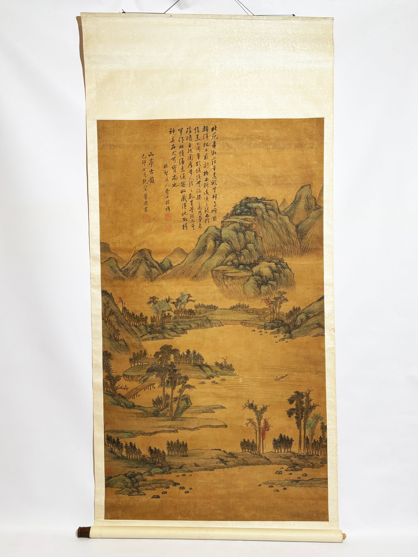 Attributed to Dong Yuan; Landscape, Hanging Scroll: Attributed to Dong Yuan; Landscape and Hanging Scroll, Ink on silk, Depicting an expansive river landscape with layered mountains, wooded shorelines, pavilions and a lone fishing boat. Accompanied by 