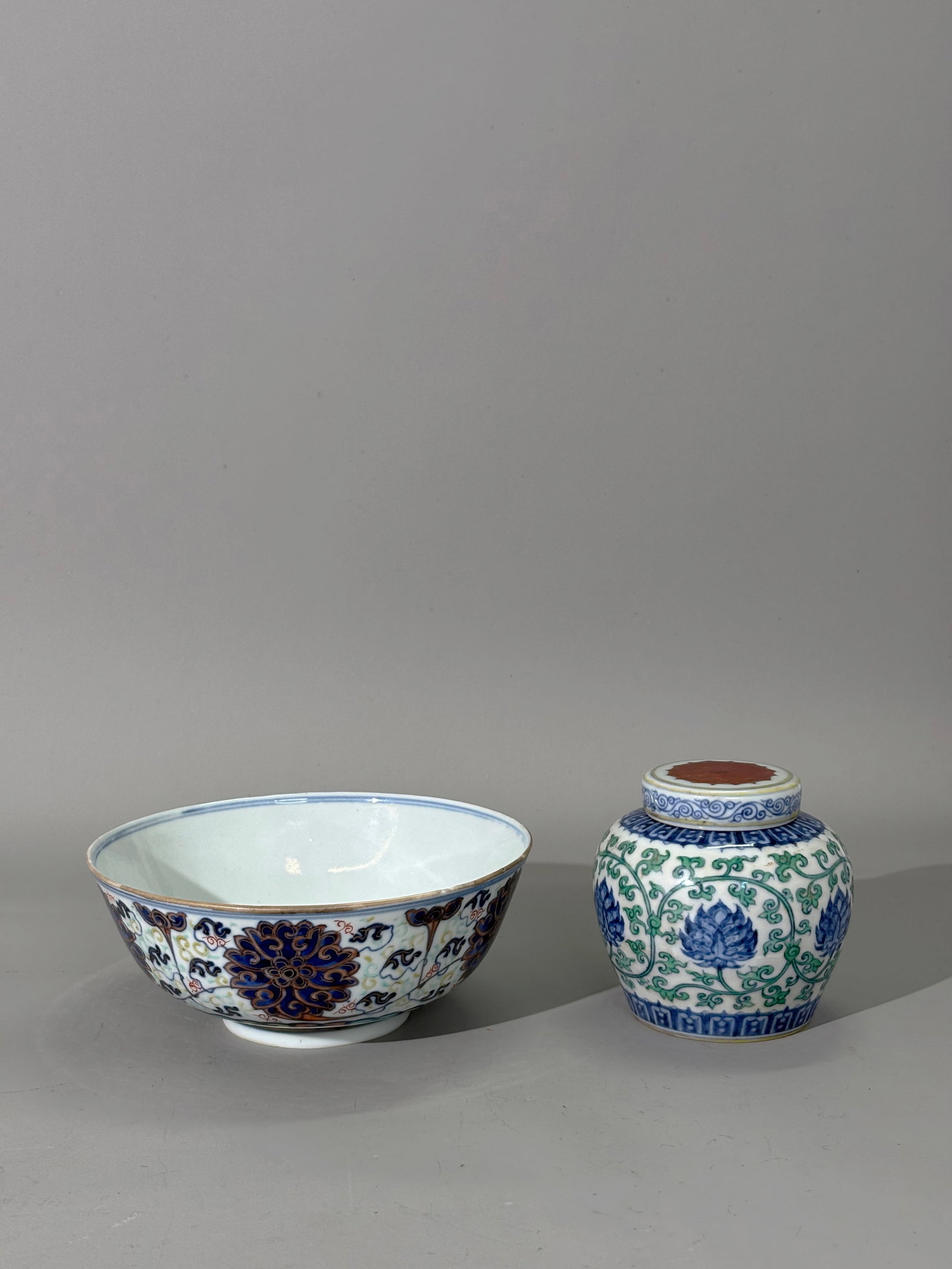 Chinese Doucai Guangxu Porcelain Bowl; Sm Tian Jar: Chinese Doucai enameled Porcelain lotus Bowl highlighted in gilding with 6 character Guangxu mark in underglaze blue to recessed base and probably of the period; together with a Small Jar with scrolli