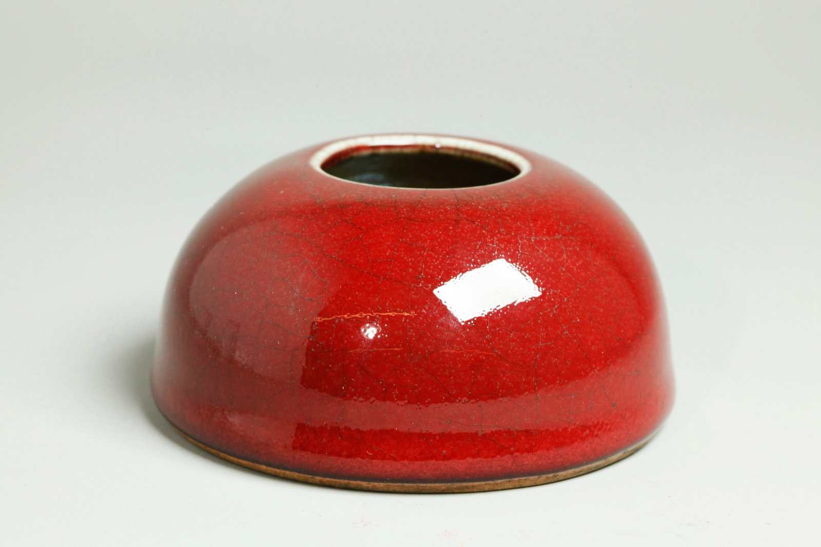 Good Chinese 19th C Langyao Porcelain Water Pot: Good Chinese 19th Century Langyao underglaze red crackle Porcelain Water Pot / brush washer; the thick, bubble suffused red glaze thinning to a clear crackle line at mouth and forming a clean roll bef