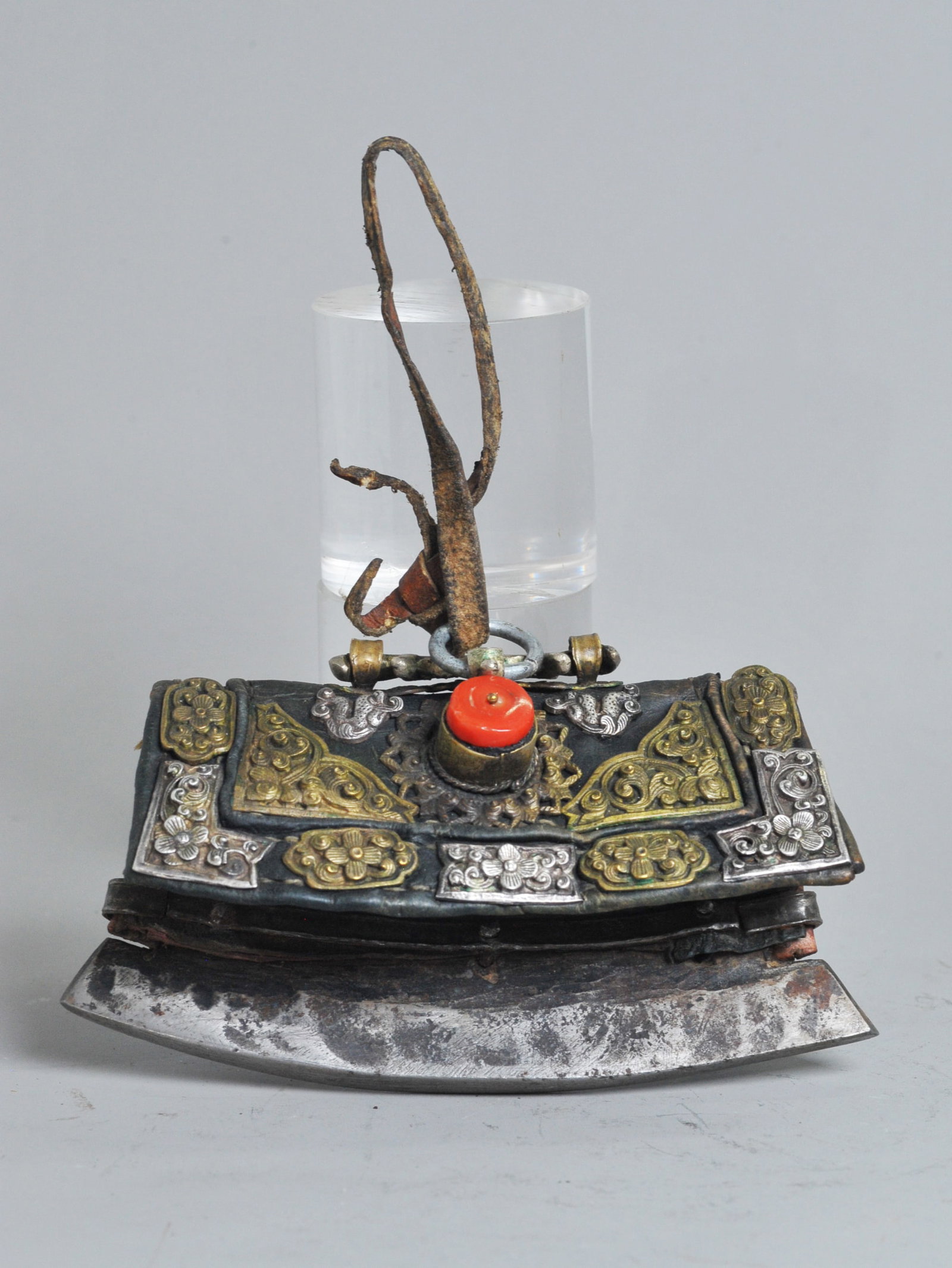 Tibetan Steel Flint Striker Mechang Leather Pocket: Tibetan Steel Flint (no flint present) Striker Mechang (chuckmuck) attached to a Leather Pocket with incised silver and bronze decorations and with a ring hanger to top fold, the closure with inset fl