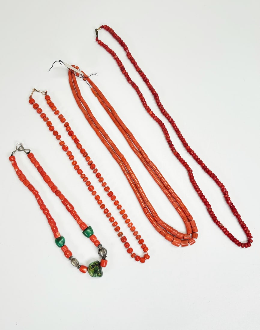 4 Chinese Tibet Antique Coral Necklaces; 137G: 4 Chinese Tibet Antique Coral Necklaces, the longest with dark coral small beads, 1 with a double strand of tube beads and no closure, 1 knotted with yellow gold wire closure and 1 with 3 turquoise sp