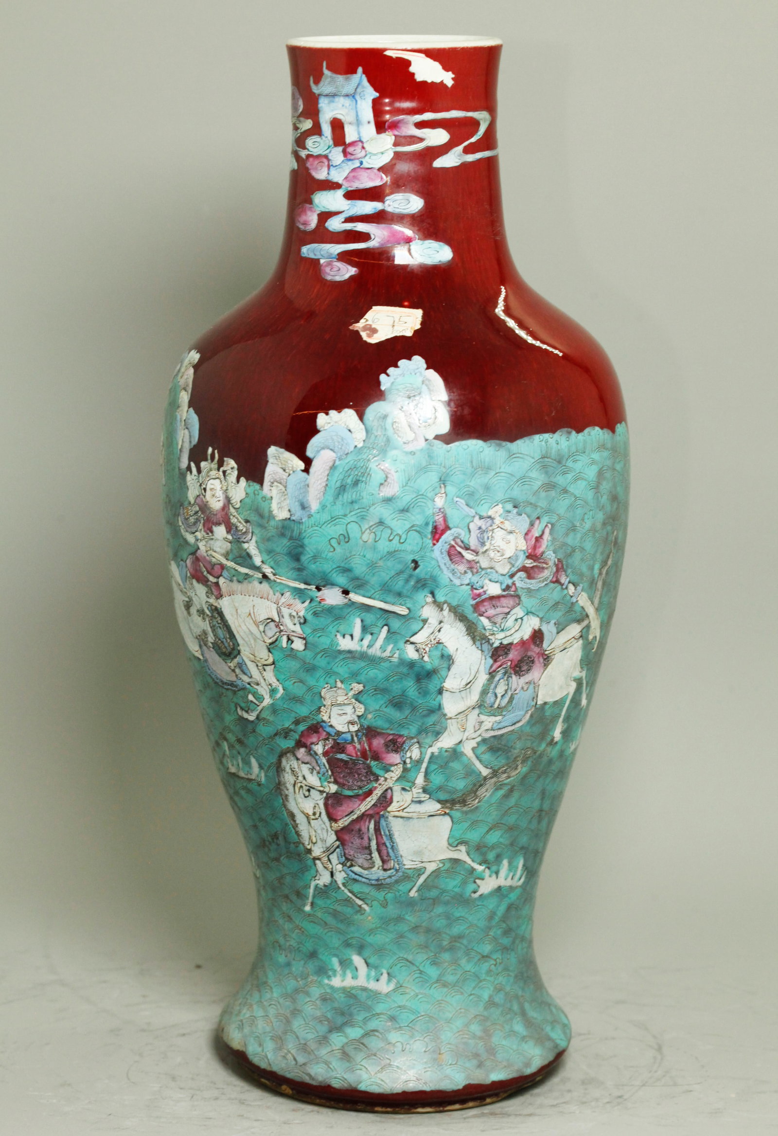 Chinese Famille Rose & Red Crackle Porcelain Vase: Chinese Famille Rose enamel over underglaze Red Crackle Porcelain Vase; the front enameled with 3 Celestial Warriors on Horseback on a ground of pale turquoise waves with ricks with details incised in