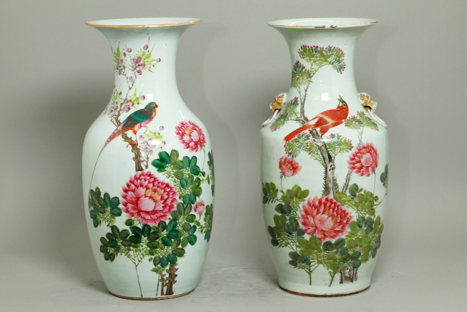 2 Similar Chinese Enameled Porcelain Vases: 2 Similar Chinese Enameled Porcelain Vases, each well enameled with an exotic Bird at the neck perched on flowering branches and each with large pink flowers, green leaves and black calligraphy inscri