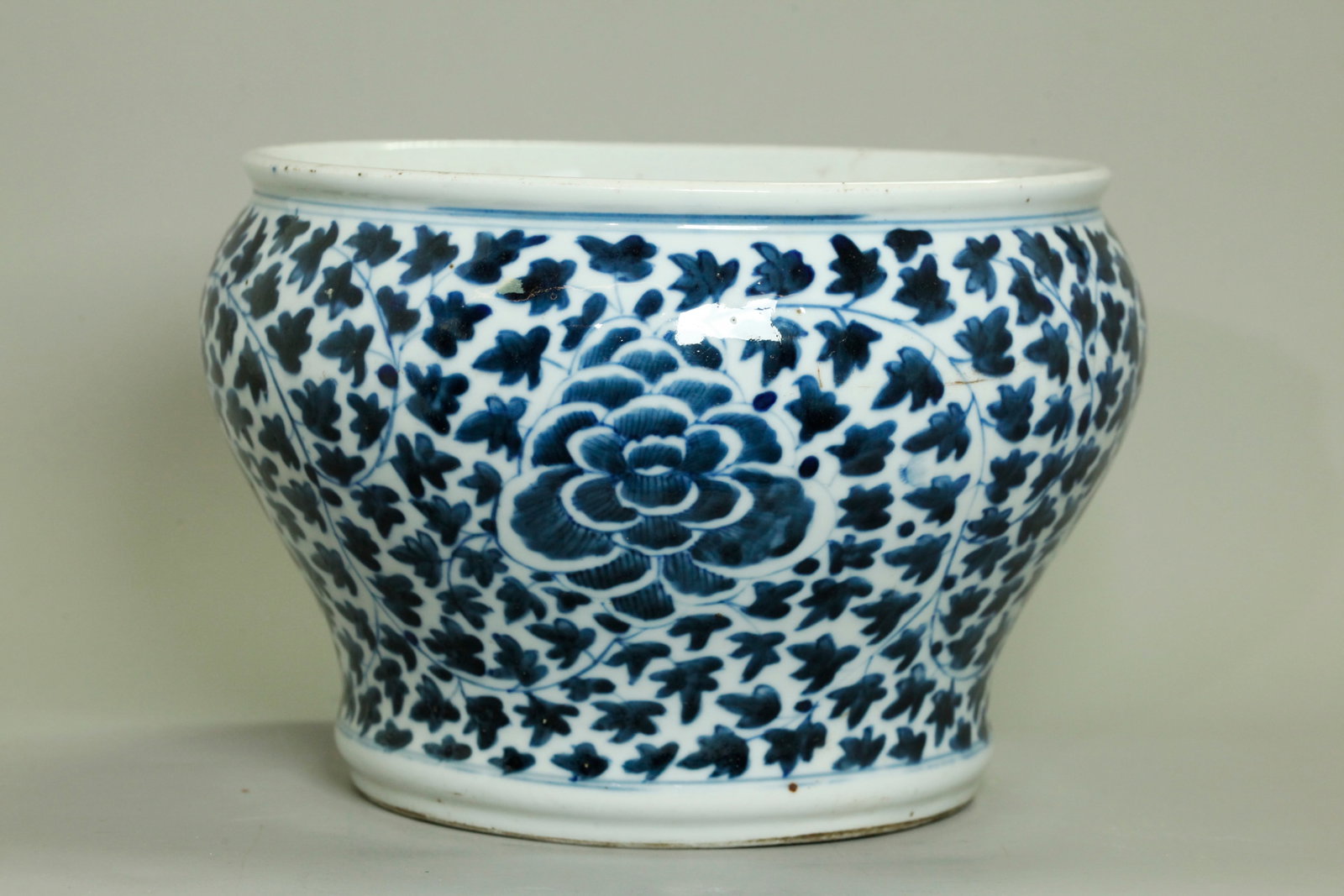 Chinese Qing Blue White Porcelain Planter Censer: Chinese Qing Dynasty Blue & White Porcelain Planter or Censer, the outside with large blue Peonies on a ground of leafy Vines; the recessed base in clear glaze. Height 6 3/4 inches X diameter of top