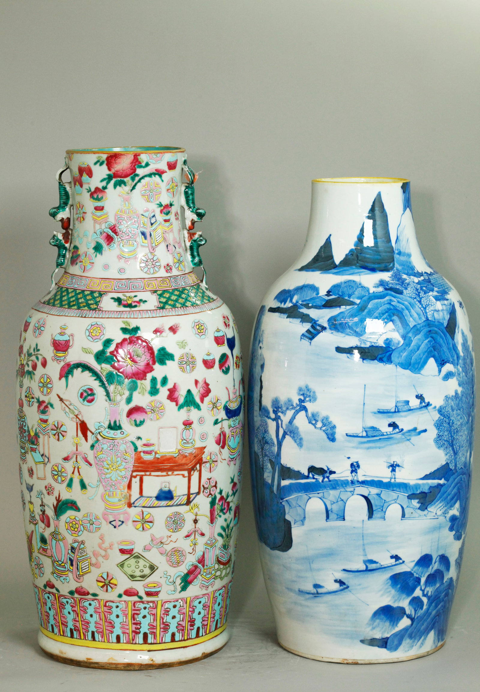 2 Chinese 19 C Porcelain Vases Enamel & Blue White: 2 Chinese 19th Century Porcelain Vases: a Famille Rose Enameled clear glazed vase with Antiques, Flowers, Ball-Shapes and Auspicious Objects with pairs of green Fu Dogs to the neck; together with a Bl