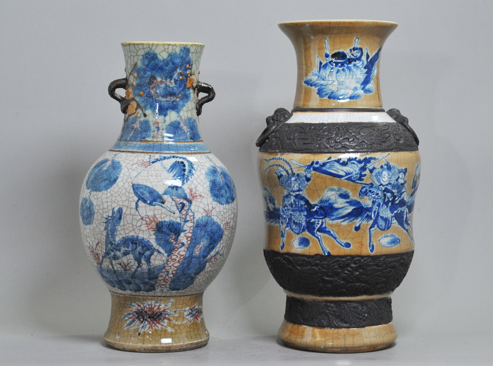 2 Chinese Qing Blue Red & Cafe Porcelain Vases: 2 Chinese Qing Dynasty Underglaze Blue & Red or Crackle & Cafe au Lait Porcelain Vases with unglazed brown slip decorations: the larger in crackle & underglaze blue on Cafe au Lait with Fu Dog Head & 