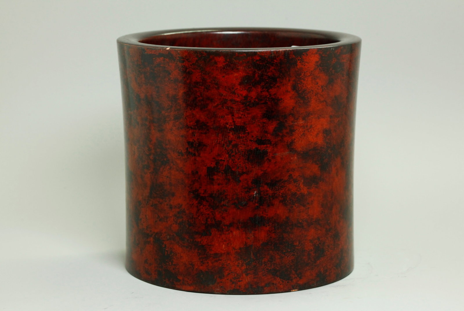 Chinese Polished Wood Bitong Brush Pot: Chinese Polished Wood Bitong Brush Pot with slightly waisted sides, the solid base with a hole and a softwood plug; the outside surface appears possibly with a dappled black stain finish over the dark