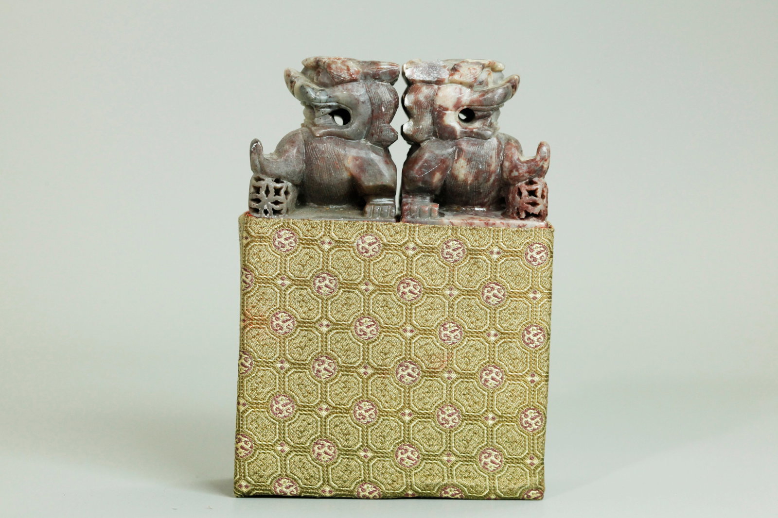 Pr Chinese Shoushan Soapstone Fu Lion Seals: Pair Chinese Shoushan Soapstone Fu Lion Seals in the same celadon-gray to brown stone with facing Fu Lion Finials each with a brocade ball, the sides incised with Rubov and Jordan with Chinese calligr