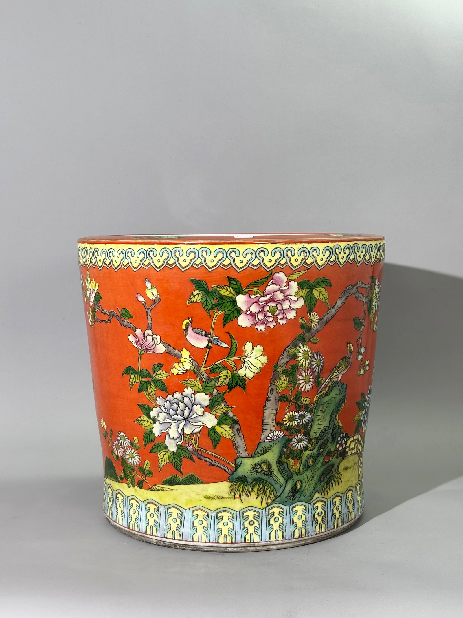 Chinese Coral-Ground Famille Rose Fish Bowl: Chinese Coral-Ground Famille Rose Porcelain Fish Bowl, Cylindrical porcelain fish bowl with flared rim, bright coral-red exterior enamel base. The outer wall is richly painted in famille rose with phe