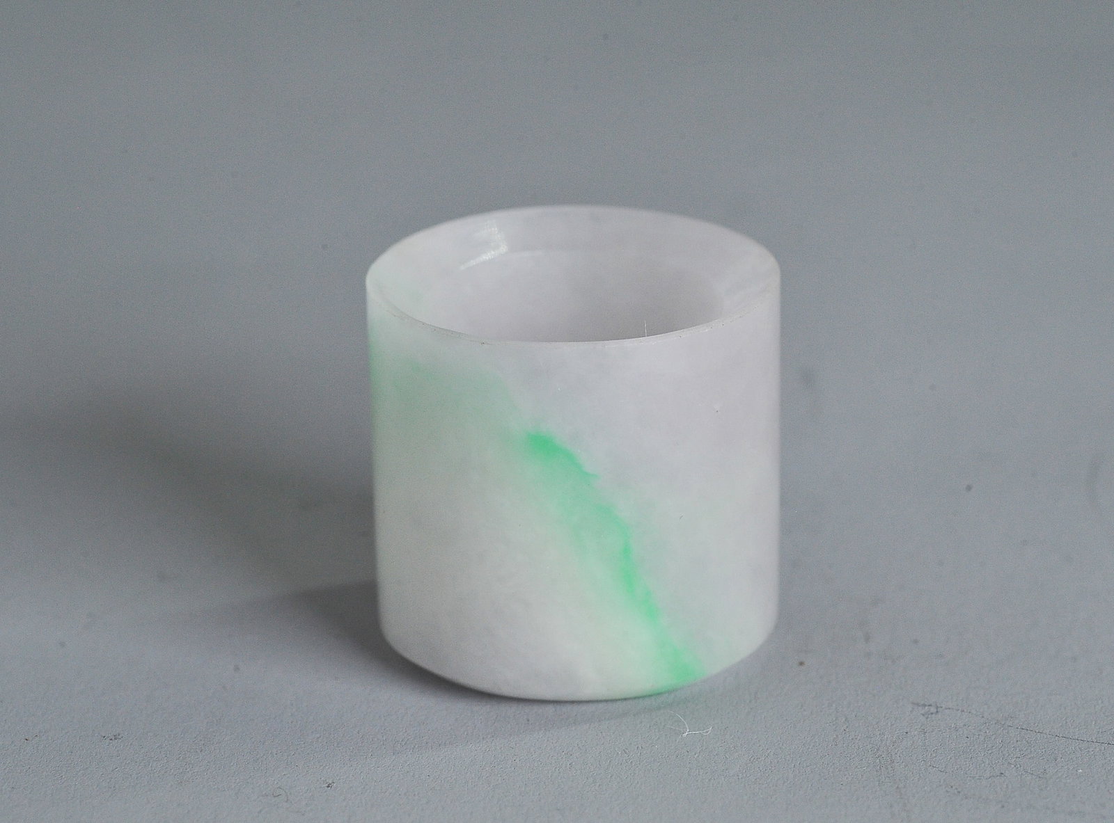 Fine Chinese Late Qing Icy Jadeite Archer's Ring: Fine Chinese Late Qing Icy Jadeite Archer's Ring the translucent stone with passages of apple green and pale lavender. Height 1 1/8 inches X diameter 1 1/4 inches.