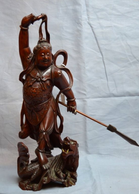 Chinese Hardwood Carving of a Soldier: Chinese Hardwood Carving of a Soldier holding a spear, a sea-dragon at his feet. Well carved and polished. Height 13 inches (33 cm.).