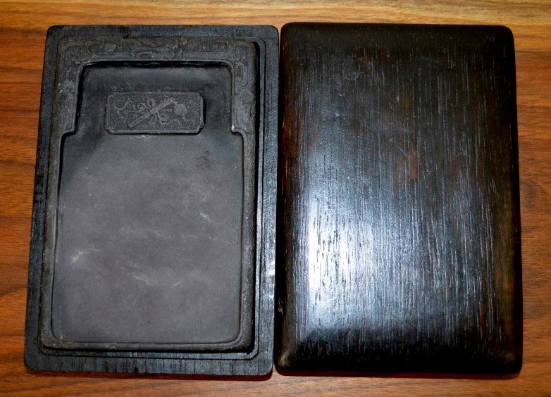 Chinese Inkstone in a Hardwood Box: Chinese Inkstone in a fitted Hardwood Box. Length of outside box 6 inches (15 cm.).