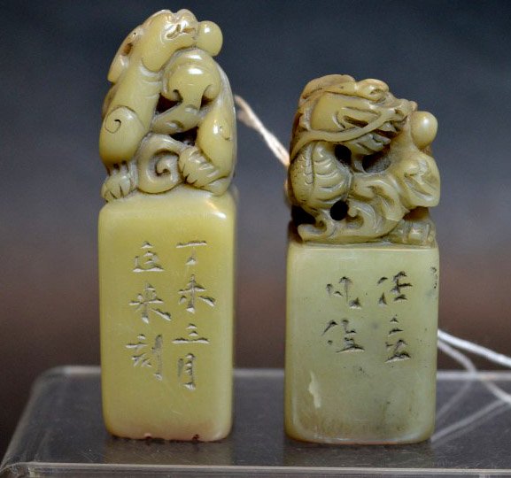 2 Chinese Carved Soapstone Seals: 2 Chinese Carved Soapstone Seals with dragon finials. Height of larger seal 2 3/4 inches (7 cm.).