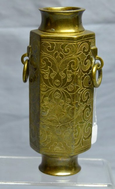 Chinese Bronze Incense Holder: Chinese Bronze Incense Holder, the sides engraved with scrolling lotus; loose ring handles. Height 4 1/2 inches (11 cm.).