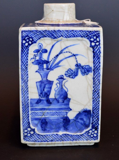 Chinese B & W and Crackle Glazed Tea Can: Chinese B & W and Crackle Glazed Tea Can with windows of flowers and vases. Height 6 1/4 inches (16 cm.). Missing top, repaired chip to corner.
