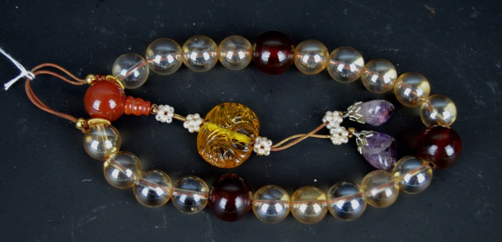 Chinese Rock Crystal, Amber & Carnelian Rosary: Chinese Rock Crystal, Amber & Carnelian Buddhist Rosary; the ends with amethyst rocks. Good condition.