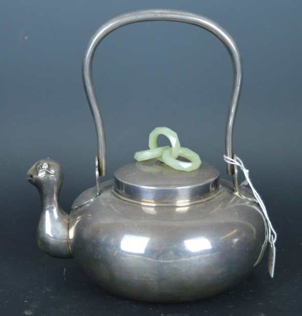 Asian Silver Teapot with 3-Ring Jade Finial: Asian Silver Teapot with 3-Ring Jade Finial, the spout in the form of an archaic animal. Diameter including spout 5 1/2 inches (14 cm.). Good condition.