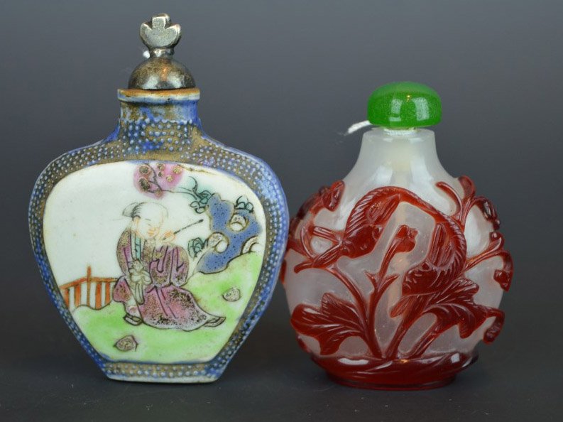 2 Chinese Snuff Bottles: 2 Chinese Snuff Bottles; the first of molded porcelain fired upside down and well painted with a figure in a landscape and calligraphy; metal top. Height including top 2 3/4 inchs (7 cm.); appropriate