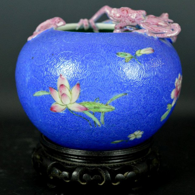 Chinese Porcelain Enameled Brush Washer: Chinese Porcelain Enameled Brush Washer Chinese Porcelain Enameled Brush Washer with a Molded Pink Dragon and Bat, the sides with sgraffito work among flowers, base with mark; hardwood stand. Diameter