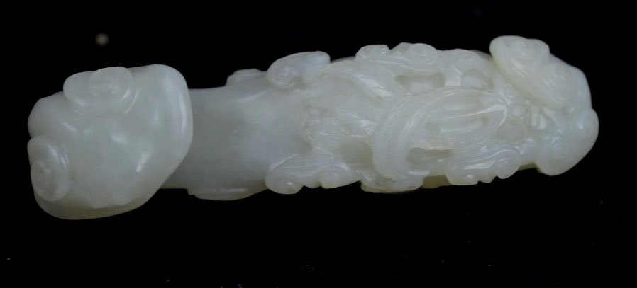 18th C. Chinese White Jade Lingzhi Belt Hook: 18th C. Chinese White Jade Lingzhi Belt Hook of high quality and mutton fat translucency. Length 3 1/2 inches 9 cm.). Two tiny holes drilled in base.