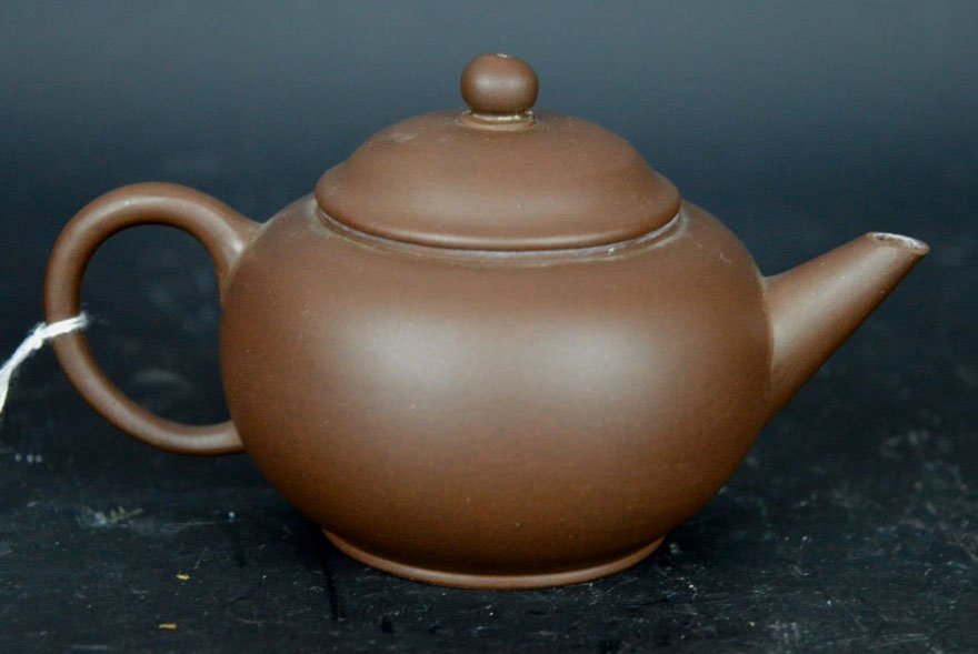 Chinese Yixing Zisha Tea Pot: Chinese Yixing Zisha Tea Pot; mark to base. Height 2 1/2 inches (6.5 cm.). Good condition, very small chip to edge of cover.