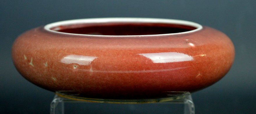 Good Chinese Underglaze Red Porcelain Brush Washer: Goo Chinese Underglaze Red Porcelain Brush Washer, the even red turning a light green at the foot rim. The base with double circles in undergaze blue. Diameter 6 inches (15 cm.). Good condition.