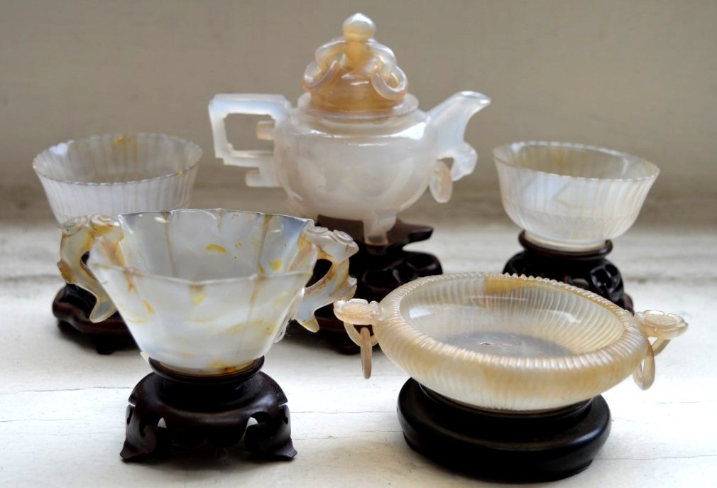 Fine Set of 5 Carved Small Chinese Agates: Fine Set of 5 Carved Small Chinese Agates: a hexagon two handled very thin flower cup, a pair of very thin chrysanthemum cups, a teapot with cover, and a loose-ring two handled brush washer also very 