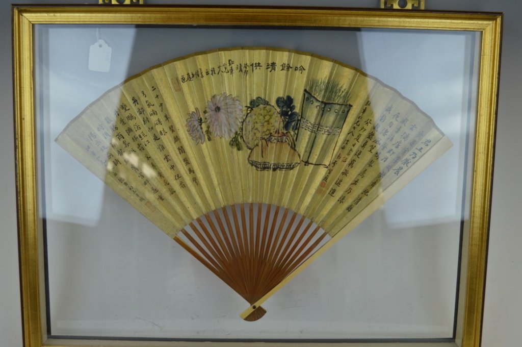 Old Chinese Scholar's Folding Fan in Frame: Old Chinese Scholar's Folding Fan on Gold paper mounted to bamboo with calligraphy and painting; now in a Frame. Short splits to paper along folds. Width of frame 21 inches (53 cm.).