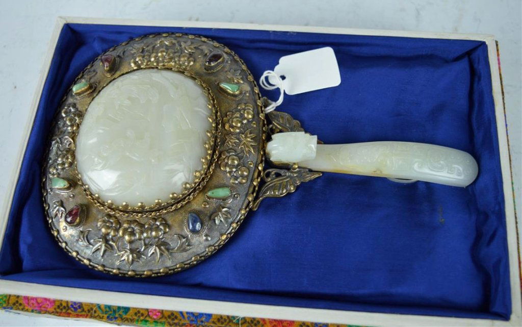 Good 18th C Chinese Carved White Jades in a Mirror: Good 18th C Chinese Carved White Jades in a Mirror; a plaque with immortals in a landscape and a handle made from a dragon buckle both now mounted in a silvered metal mirror. Good condition. Provenanc