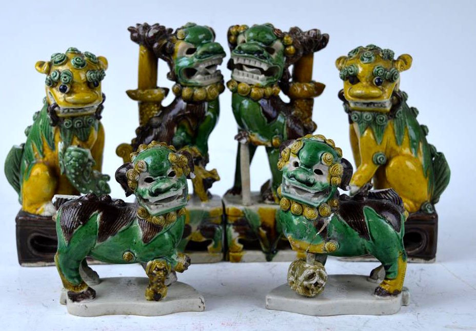 6 18th C Chinese Egg & Spinach over Bisquit Foo Dogs: 6 18th C Chinese Egg & Spinach over Bisquit Foo Dogs forming 3 opposing pairs. Each with small damages and missing chips. Height of largest dog 6 inches (15 cm.).