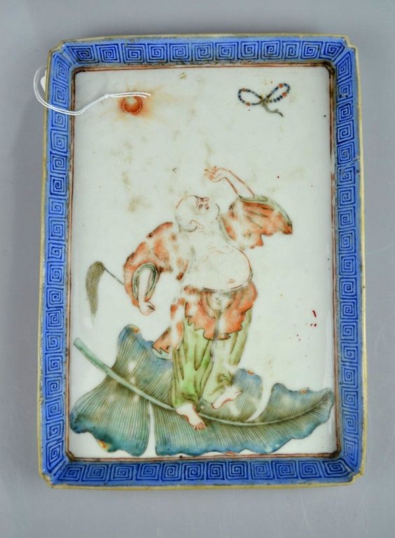 19th C Chinese Enameled Porcelain Rectangle Tray: 19th C Chinese Enameled Porcelain Rectangle Tray well painted with a Buddhist on a banana leaf throwing up his rosary to the sun. Porcelain in good condition, wear to center surface. Height 9 1/2 inch