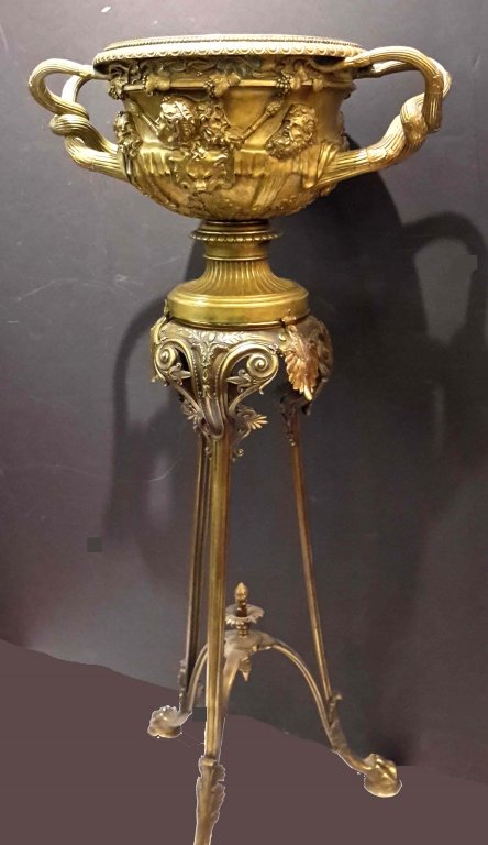 Large Bronze Casting of "The Warwick Urn" on Stand: Large 19th Century Bronze Casting of "The Warwick Urn" originally found in Hadrian's Villa in Rome by Gavin Hamilton in 1771 and now in the Burrell Collection in Scotland; on a 19th Century Stand desi