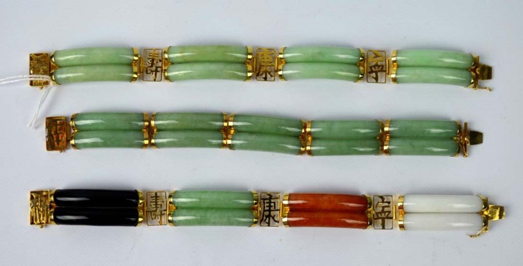 3 Chinese Polished Jadeite 14K Gold Link Bracelets: 3 Chinese Polished Jadeite and Gold marked 14K & 585 Link Bracelets, two in matching green color and one of 4 colors. Good condition. Total length of each 7 1/2 inches (19 cm.).Provenance: The 1960's