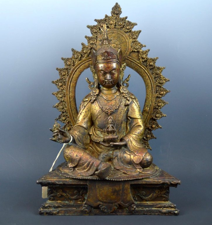 China/Tibet Large Bronze Padmasambhava: China/Tibet Large Bronze Padmasambhava seated on trapezoid throne with separate matching bronze mandala behind. Good condition, light age related wear. Total height 14 1/2 inches (37 cm.).